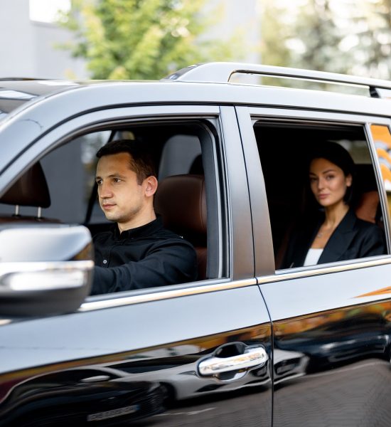 side-view-of-a-luxury-suv-vehicle-with-male-driver-2025-03-15-18-43-22-utc-min