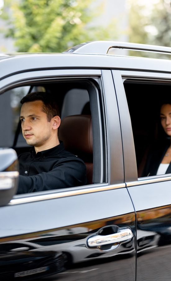 side-view-of-a-luxury-suv-vehicle-with-male-driver-2025-03-15-18-43-22-utc-min
